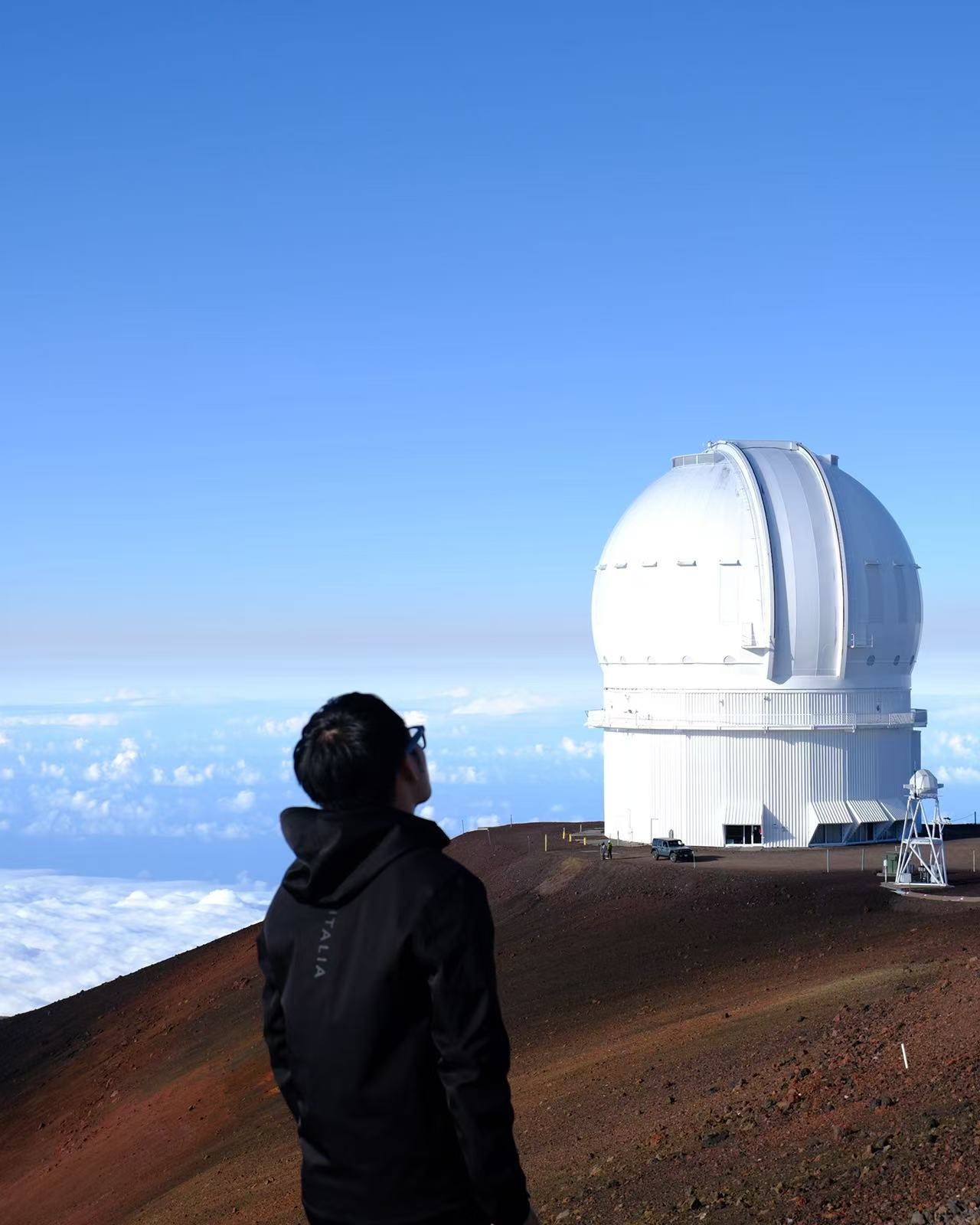 Looking up at a telescope dome on Mauna Kea, above the clouds